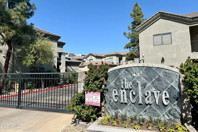 a view of a street with a house in the background