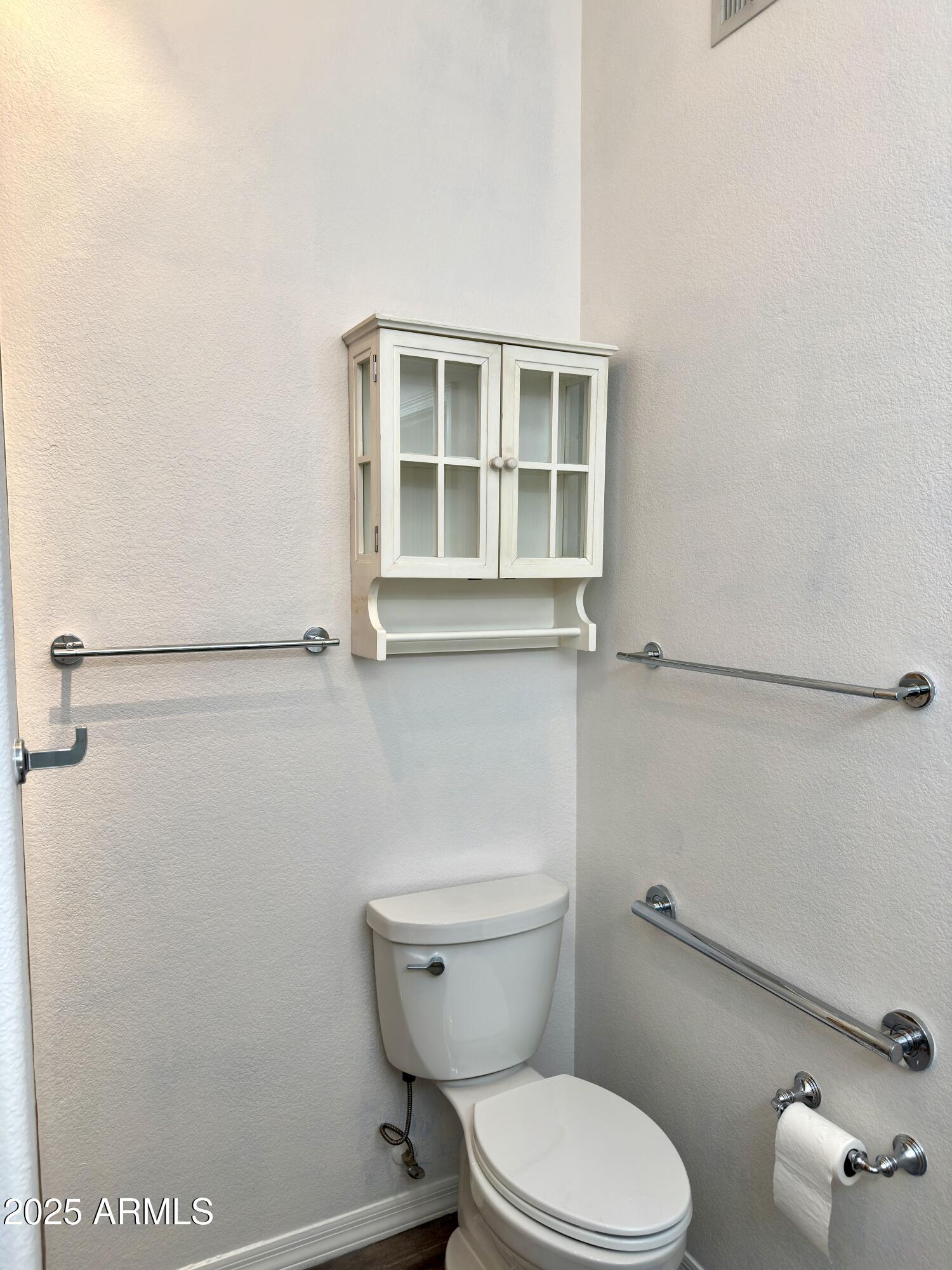 4533 North 22nd Street, Unit 127 Phoenix, AZ 85016 - Photo 15 of 30 a white toilet sitting next to a bathroom sink