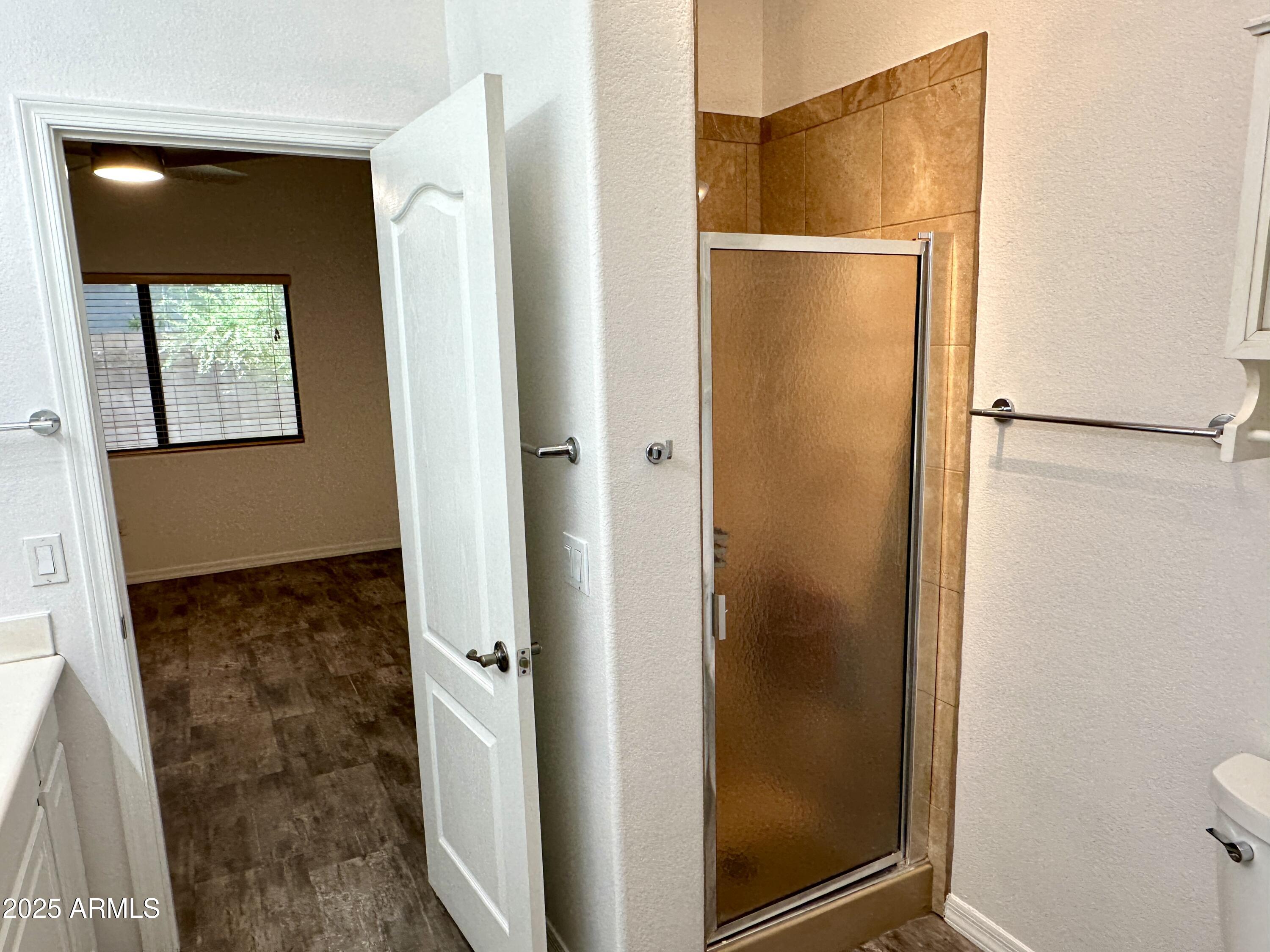4533 North 22nd Street, Unit 127 Phoenix, AZ 85016 - Photo 17 of 30 a bathroom with a glass door shower and a sink