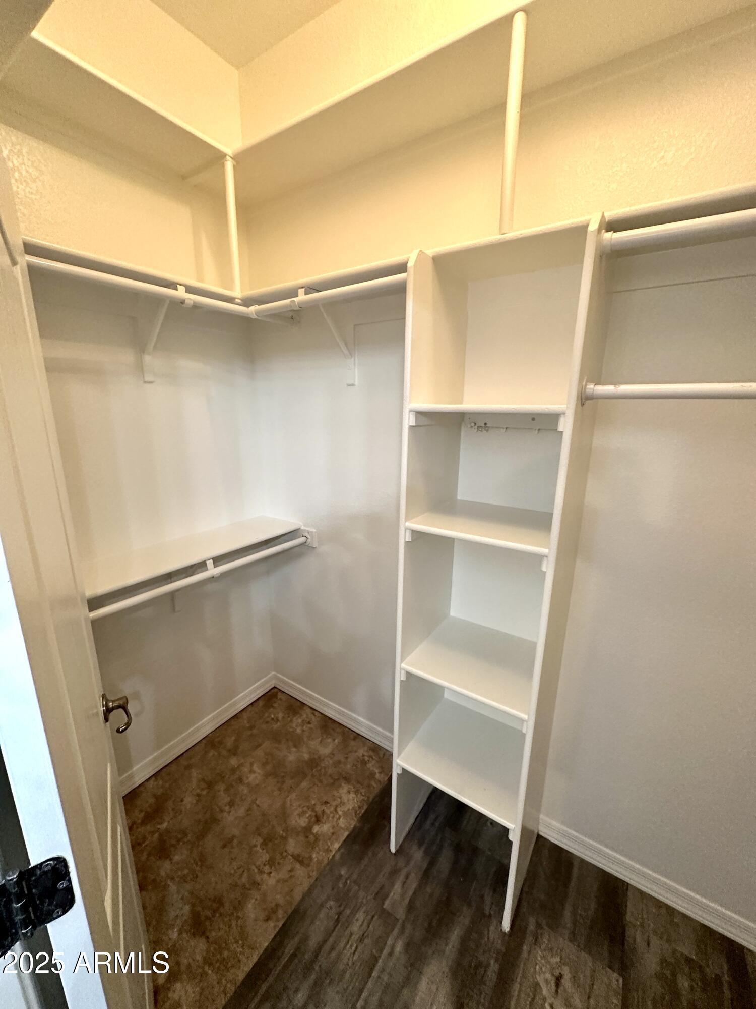 4533 North 22nd Street, Unit 127 Phoenix, AZ 85016 - Photo 18 of 30 a view of walk in closet with empty racks