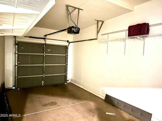 a view of storage and utility room with two washing machine