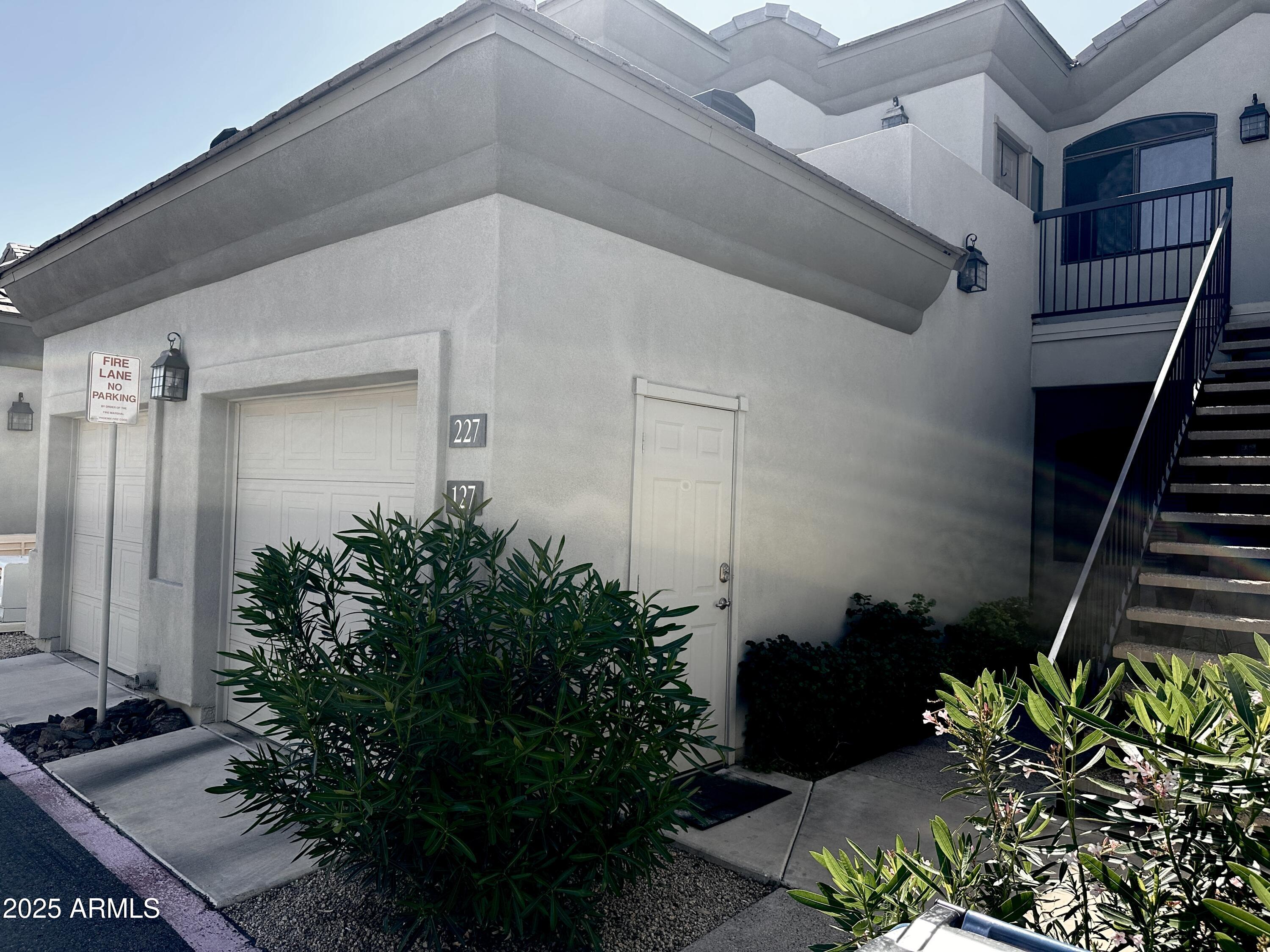 4533 North 22nd Street, Unit 127 Phoenix, AZ 85016 - Photo 3 of 30 a potted plant sitting in front of a house