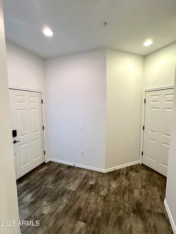an empty room with wooden floor