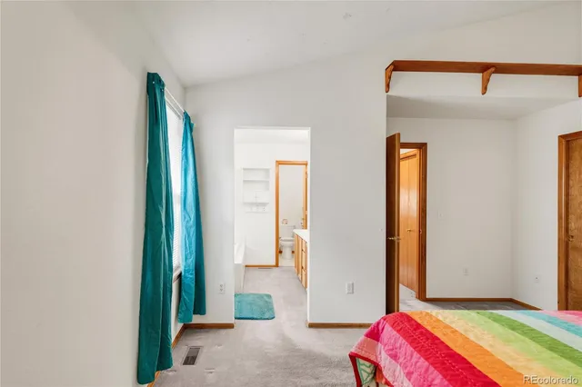 a en suite bathroom with a sink and a mirror