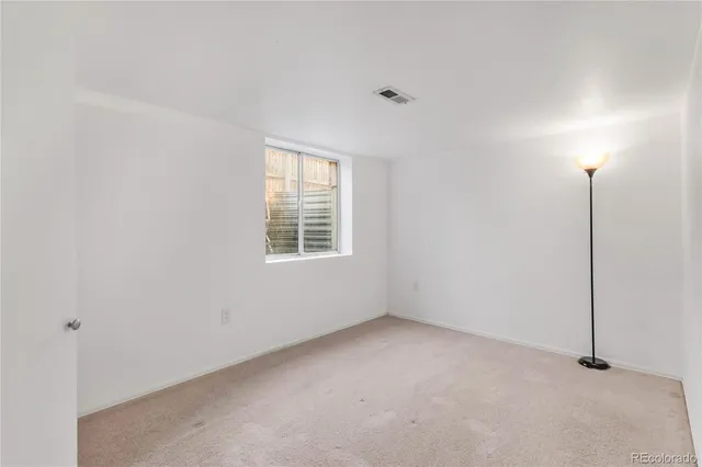 a view of a house with backyard and a garden