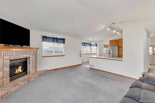 a view of livingroom with furniture and a fireplace