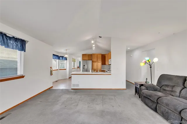 a living room with furniture and a couch