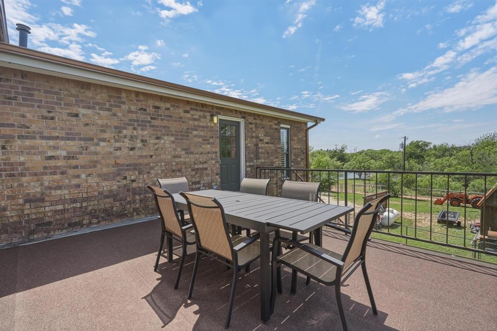 432 Clark Road Abilene, TX 79602 - Photo 34 of 40 a view of a roof deck with table and chairs