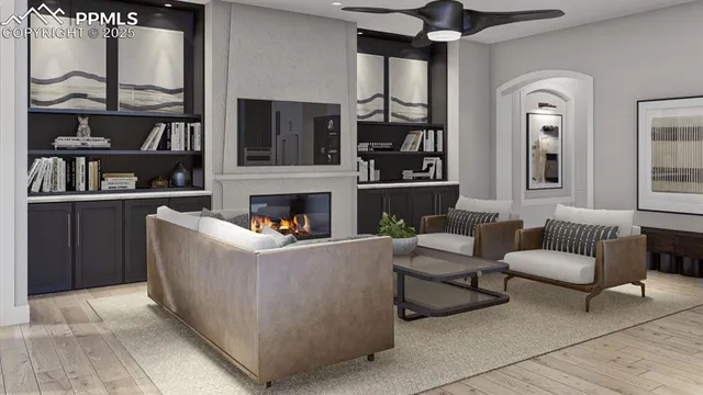 a living room with furniture a rug and a fireplace