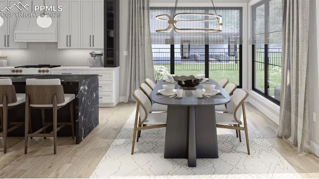 a kitchen with a table chairs and a window