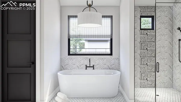 a white bath tub sitting in a bathroom next to a window