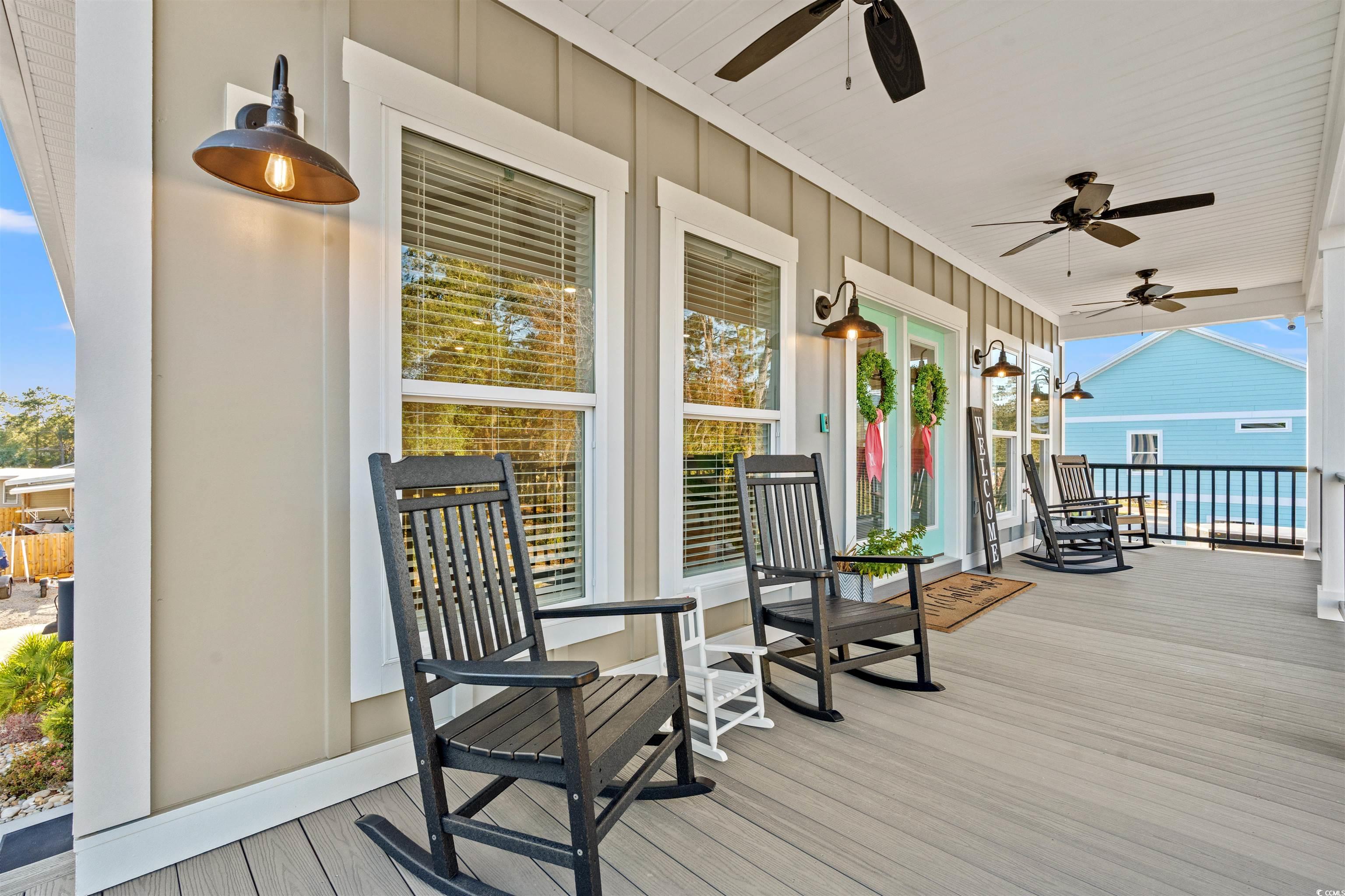 355 Oak Avenue Murrells Inlet, SC 29576 - Photo 6 of 34 Deck featuring ceiling fan and covered porch