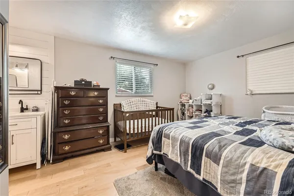 a bedroom with a bed and a dresser