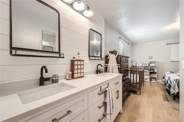 a kitchen with a sink a stove and cabinets