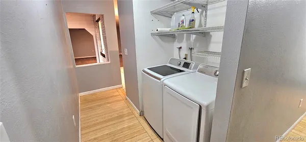a view of a kitchen with a sink and cabinets