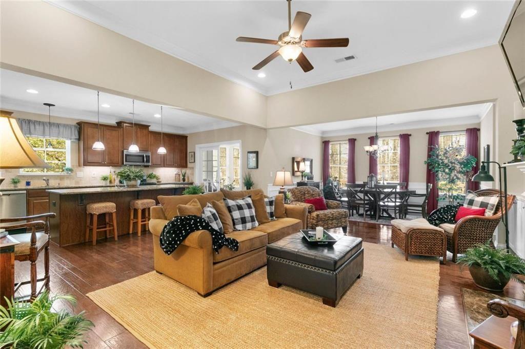 559 Bishopton Street Southeast Grayson, GA 30017 - Photo 13 of 34 a living room with furniture kitchen view and a large window