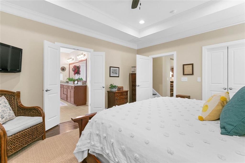 559 Bishopton Street Southeast Grayson, GA 30017 - Photo 24 of 34 a spacious bedroom with a bed and a couch