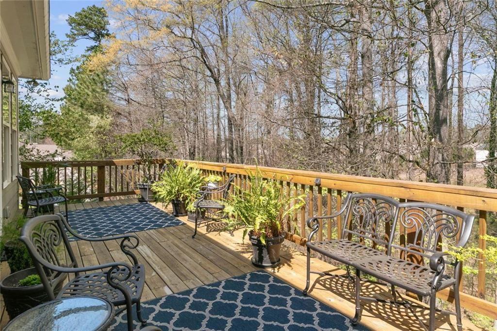 559 Bishopton Street Southeast Grayson, GA 30017 - Photo 33 of 34 a view of balcony with wooden floor and outdoor seating