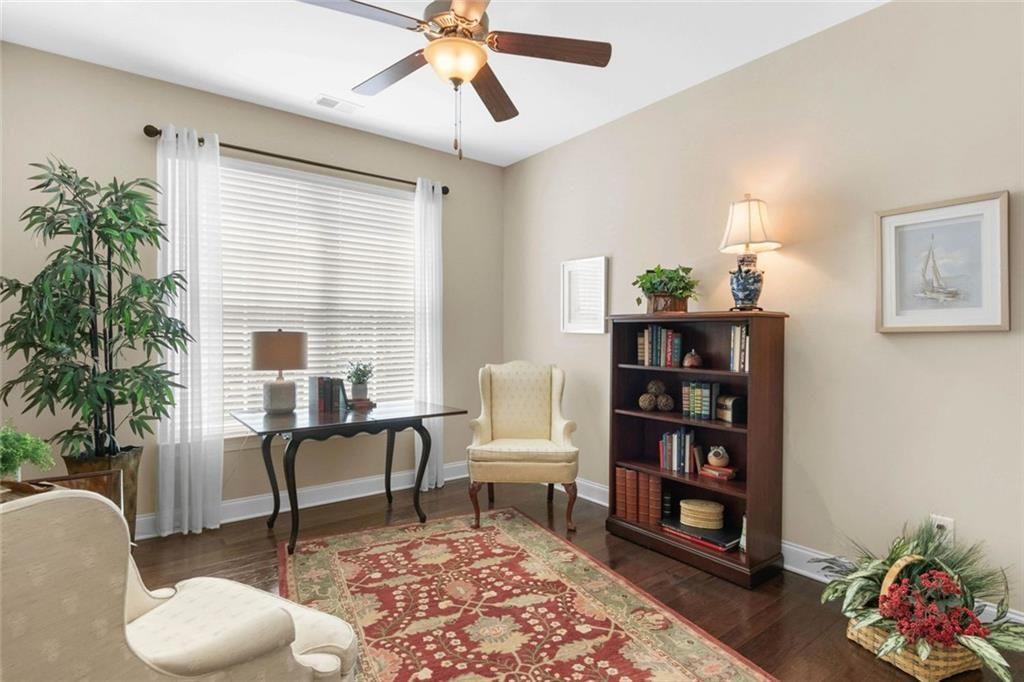 559 Bishopton Street Southeast Grayson, GA 30017 - Photo 9 of 34 a living room with furniture and a potted plant