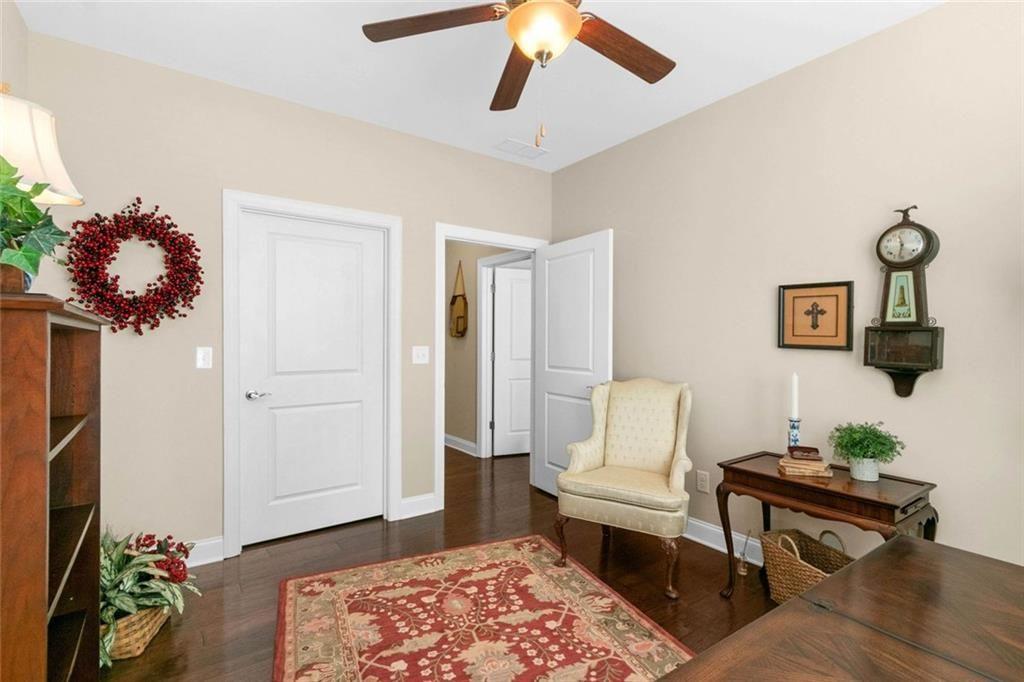 559 Bishopton Street Southeast Grayson, GA 30017 - Photo 10 of 34 a living room with furniture and wooden floor