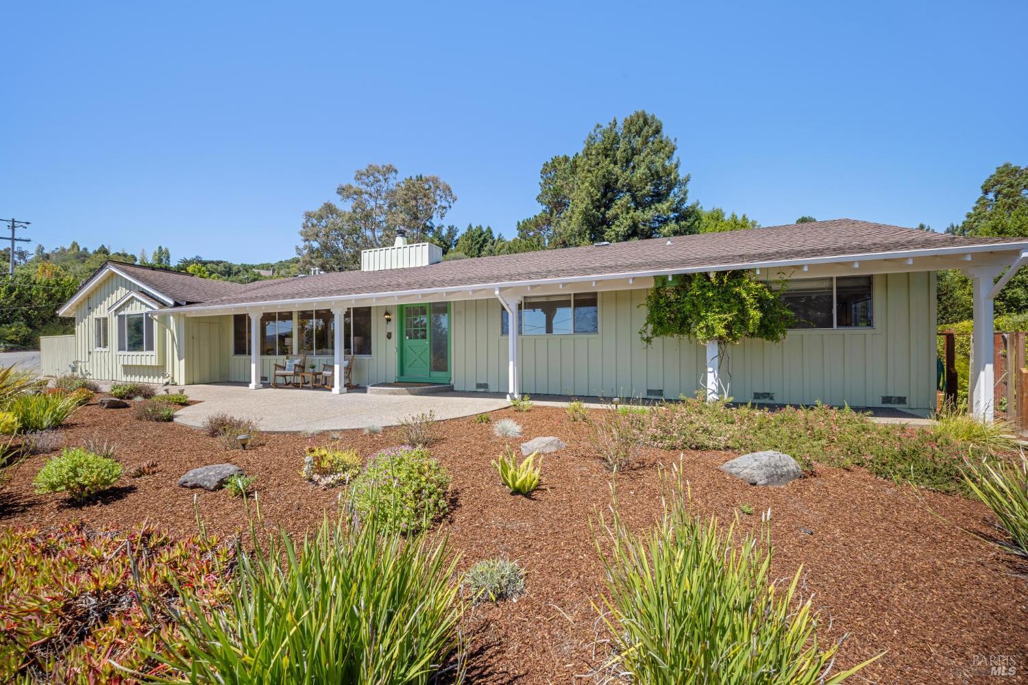 1 Vasco Drive Mill Valley, CA 94941 - Photo 1 of 1 a front view of a house with a yard and potted plants