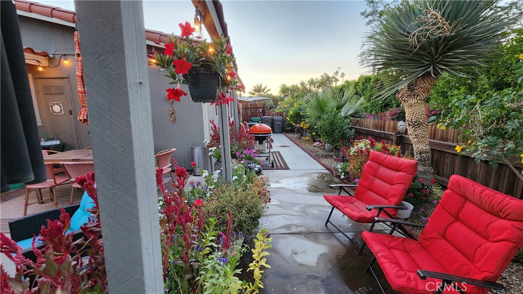 81641 Ave 48, Unit SPC 104 Indio, CA 92201 - Photo 12 of 50 an outdoor living space with furniture and a potted plant