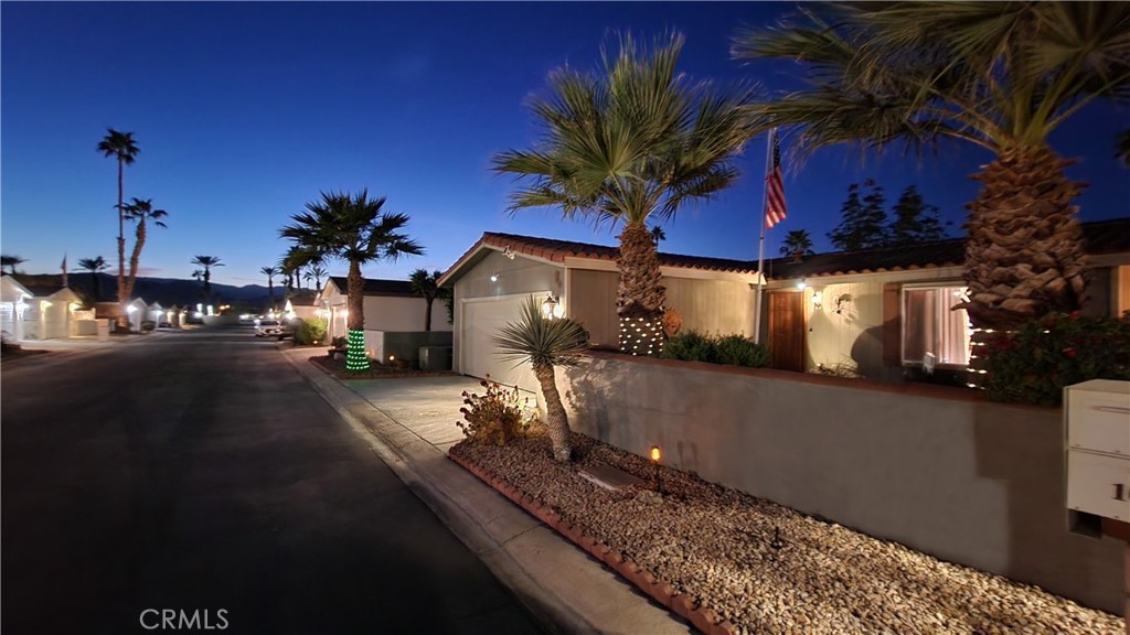 81641 Ave 48, Unit SPC 104 Indio, CA 92201 - Photo 3 of 50 a house view with a garden space