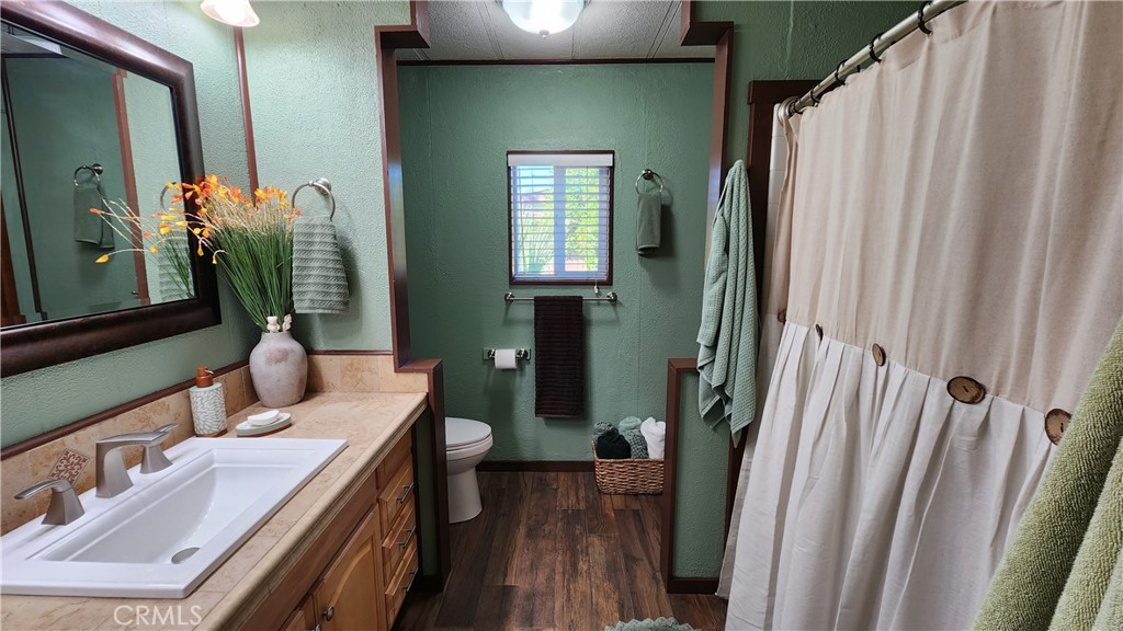 81641 Ave 48, Unit SPC 104 Indio, CA 92201 - Photo 31 of 50 a bathroom with sink and mirror