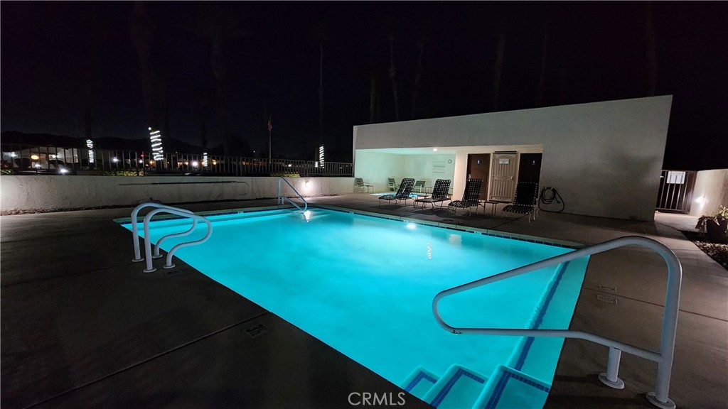 81641 Ave 48, Unit SPC 104 Indio, CA 92201 - Photo 43 of 50 a view of a swimming pool with seating area