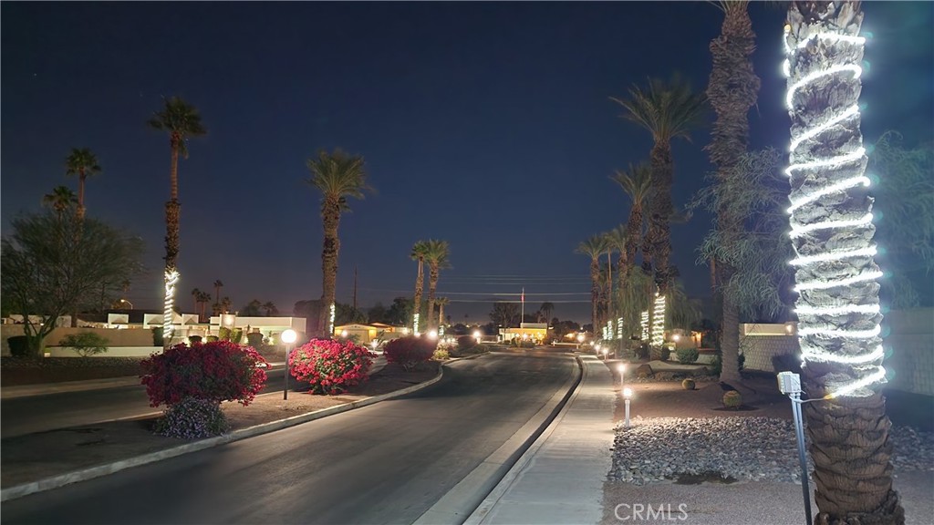 81641 Ave 48, Unit SPC 104 Indio, CA 92201 - Photo 50 of 50 a view of a street with cars parked