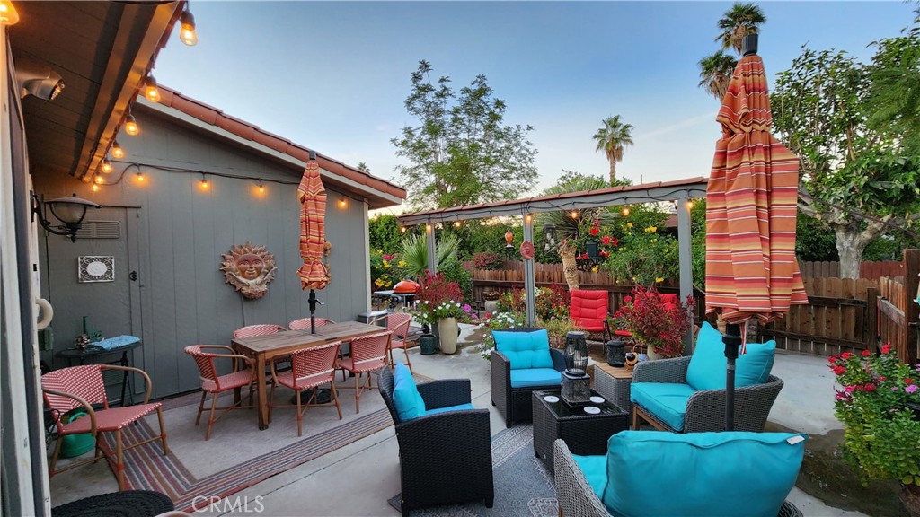 81641 Ave 48, Unit SPC 104 Indio, CA 92201 - Photo 6 of 50 a outdoor living space with furniture potted plant and a large window