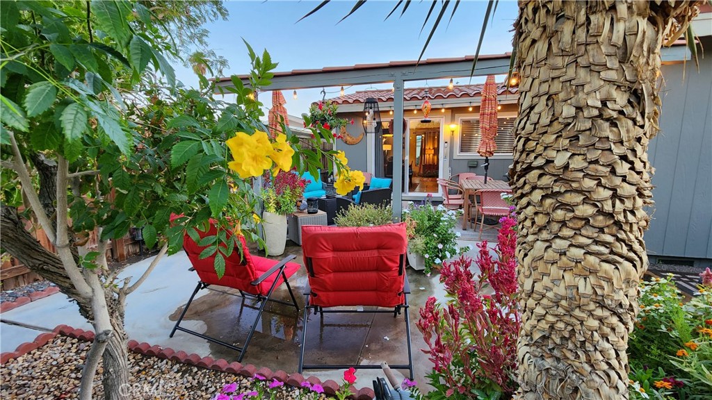 81641 Ave 48, Unit SPC 104 Indio, CA 92201 - Photo 7 of 50 a view of a chairs and tables in the patio
