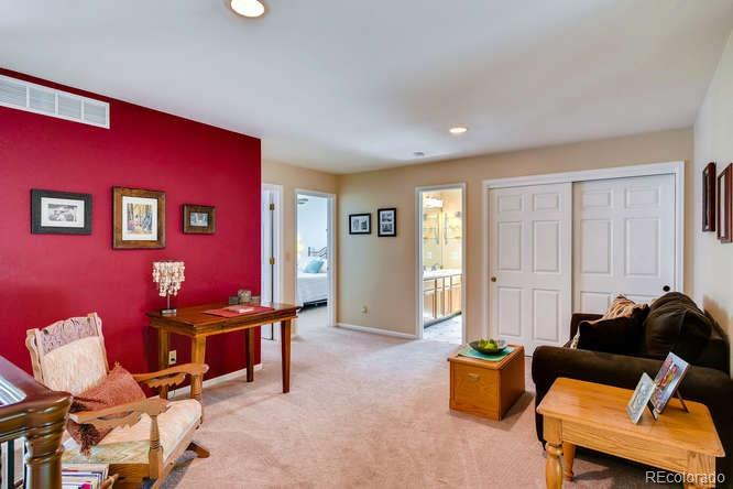 809 Huntington Place Highlands Ranch, CO 80126 - Photo 19 of 28 a living room with furniture