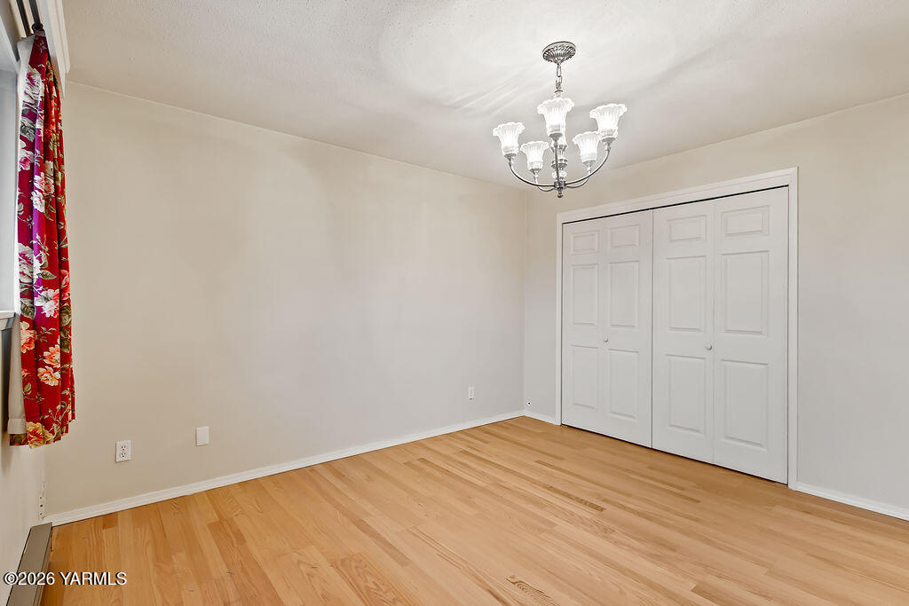 7610 Summitview Avenue, Unit 11 Yakima, WA 98908 - Photo 17 of 20 a view of an empty room with a chandelier