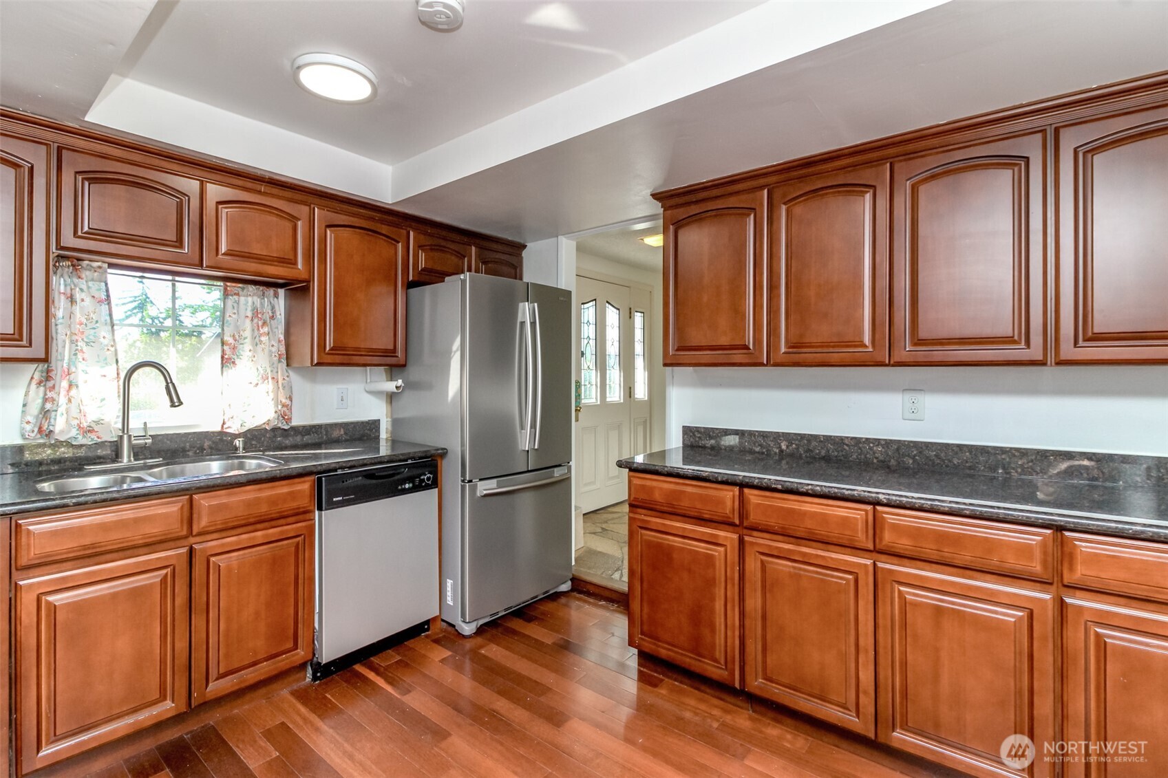 32622 39th Avenue Southwest Federal Way, WA 98023 - Photo 12 of 40 a kitchen with granite countertop stainless steel appliances a refrigerator and a sink
