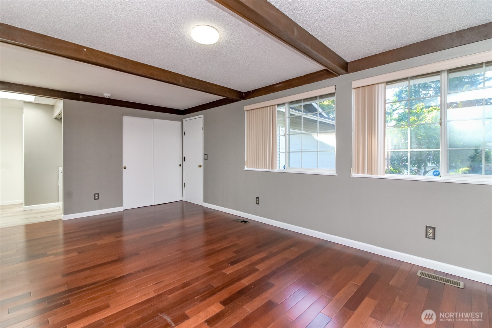 32622 39th Avenue Southwest Federal Way, WA 98023 - Photo 16 of 40 a view of an empty room with wooden floor and a window