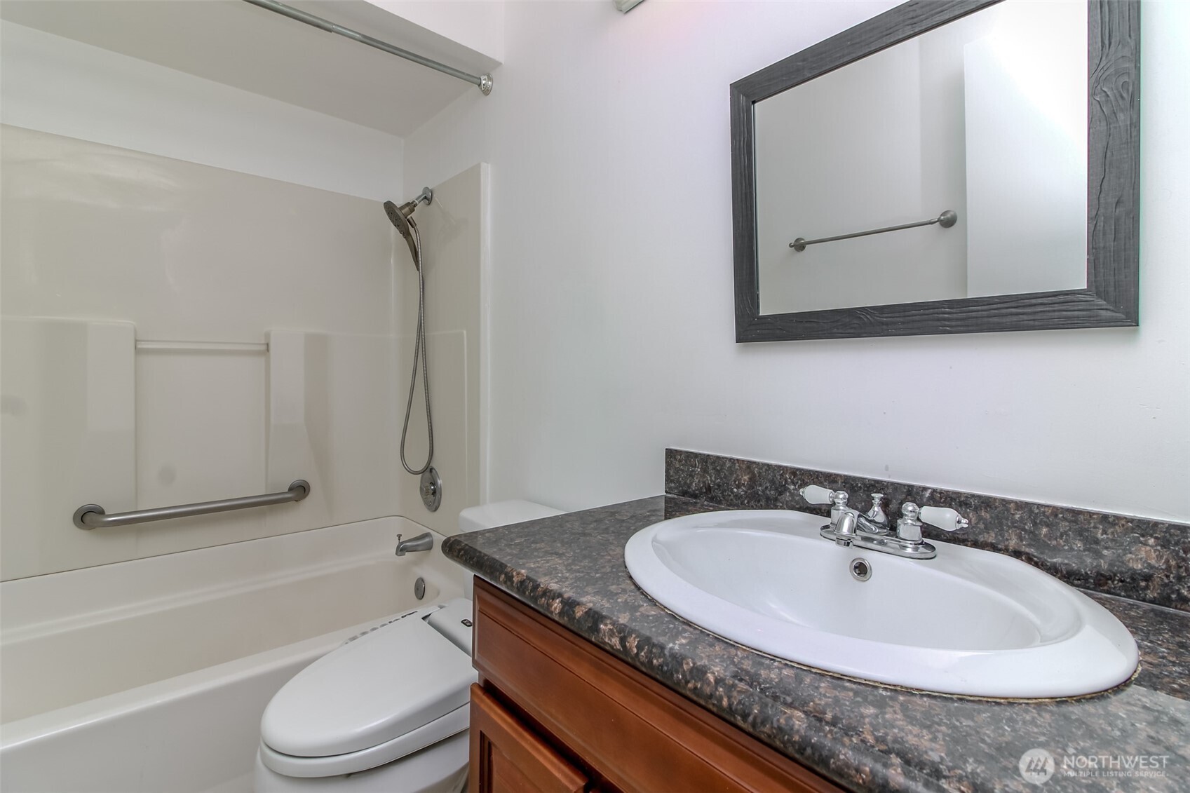 32622 39th Avenue Southwest Federal Way, WA 98023 - Photo 22 of 40 a bathroom with a granite countertop sink toilet and mirror