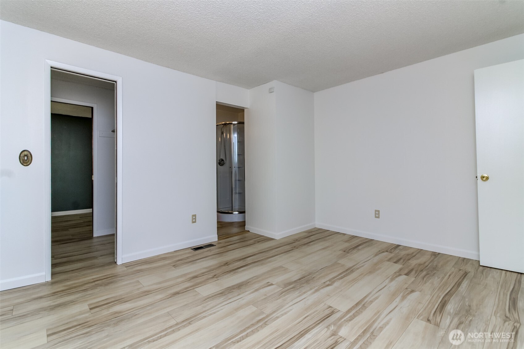 32622 39th Avenue Southwest Federal Way, WA 98023 - Photo 27 of 40 a view of an empty room with wooden floor and closet