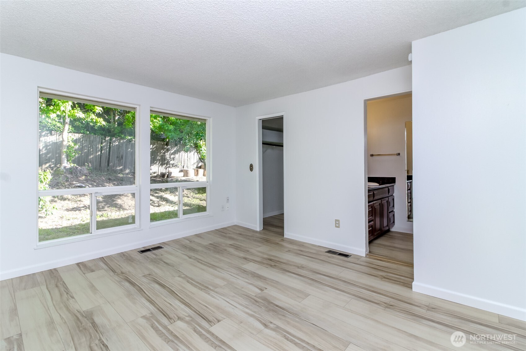 32622 39th Avenue Southwest Federal Way, WA 98023 - Photo 28 of 40 an empty room with wooden floor and windows