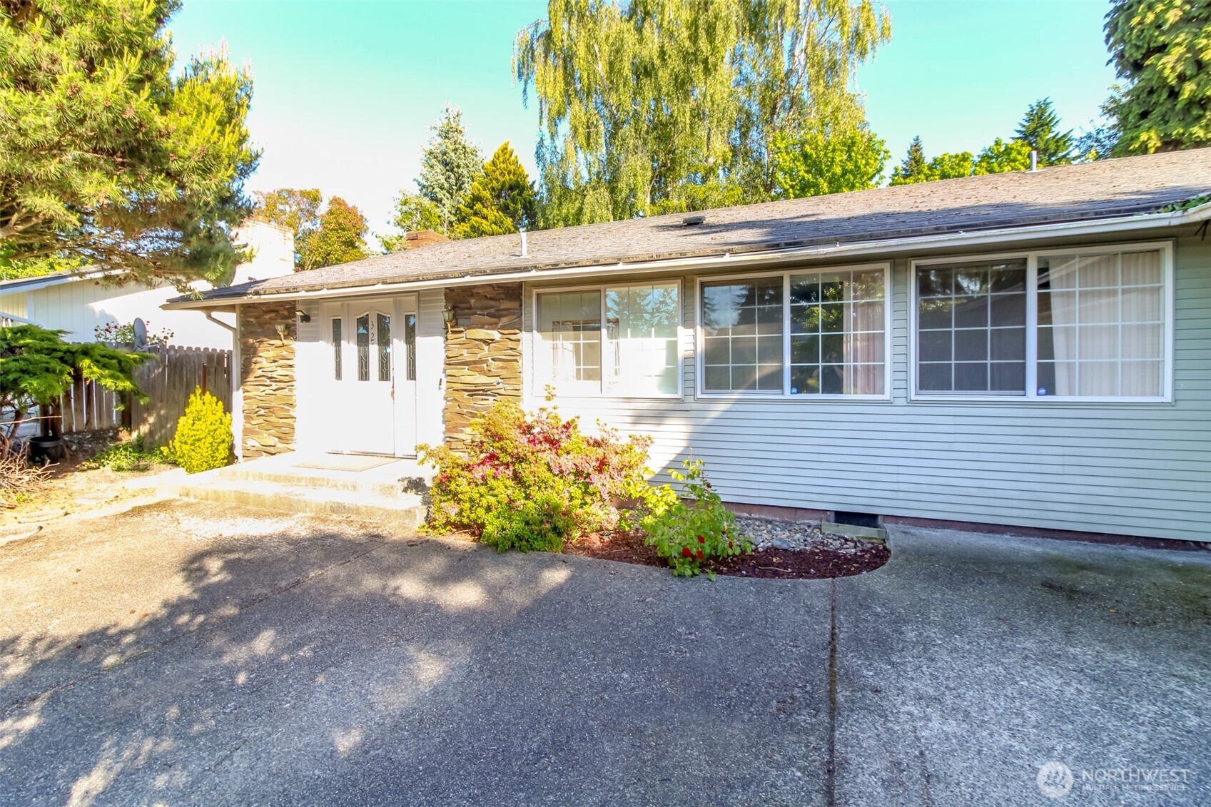 32622 39th Avenue Southwest Federal Way, WA 98023 - Photo 32 of 40 a front view of a house with a yard and outdoor seating