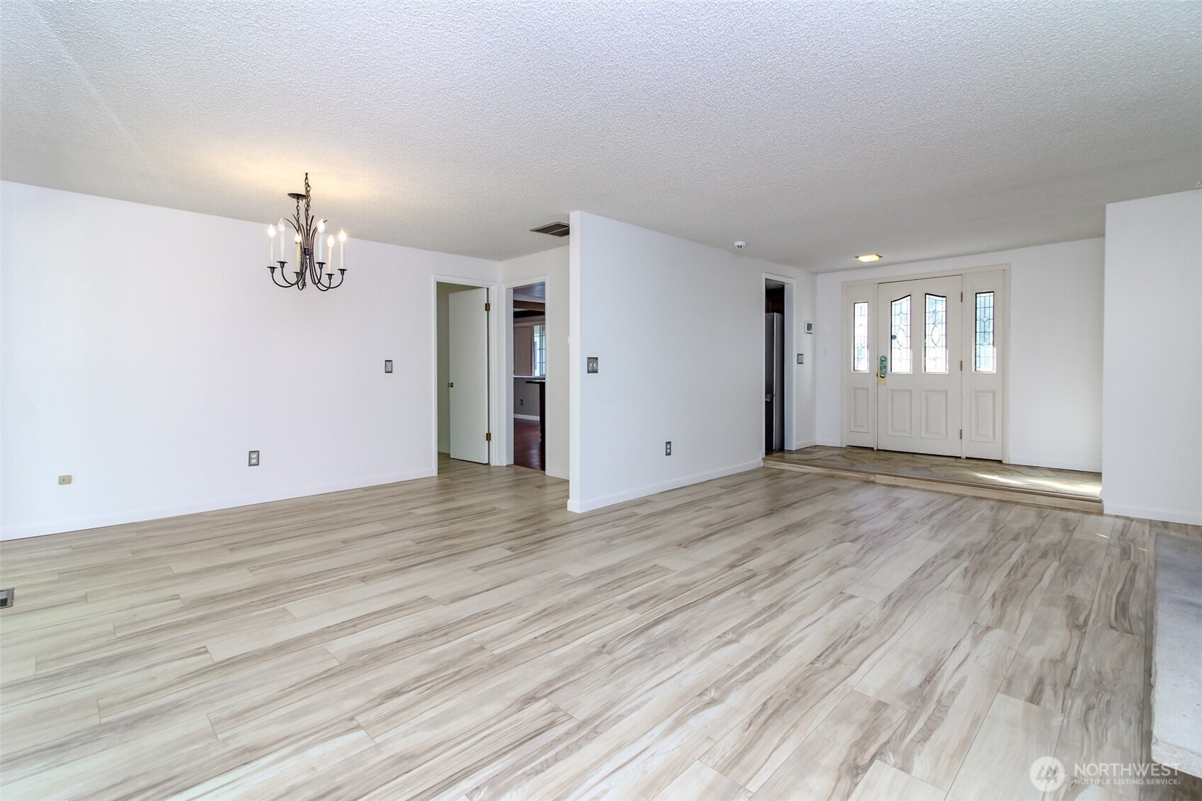 32622 39th Avenue Southwest Federal Way, WA 98023 - Photo 8 of 40 an empty room with wooden floor and window