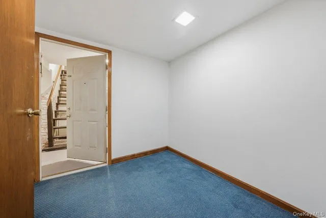 an empty room with wooden floor