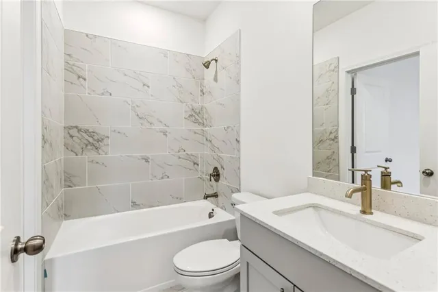 a bathroom with a sink a toilet and a bathtub