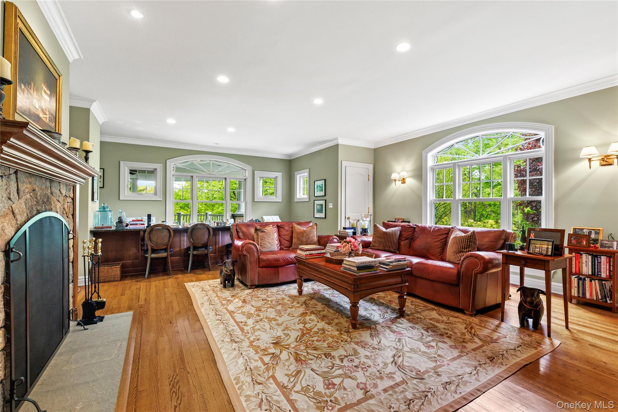 63 Old Mill River Road Pound Ridge, NY 10576 - Photo 17 of 47 a living room with furniture fireplace and a table