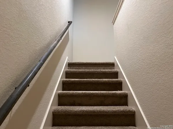 a view of staircase with empty racks