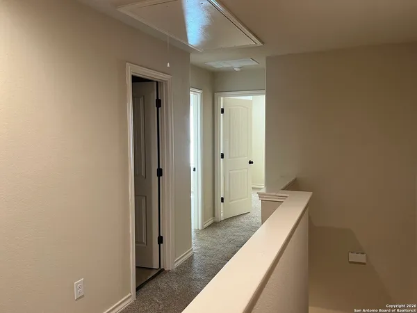 a bathroom with a double vanity sink and mirror