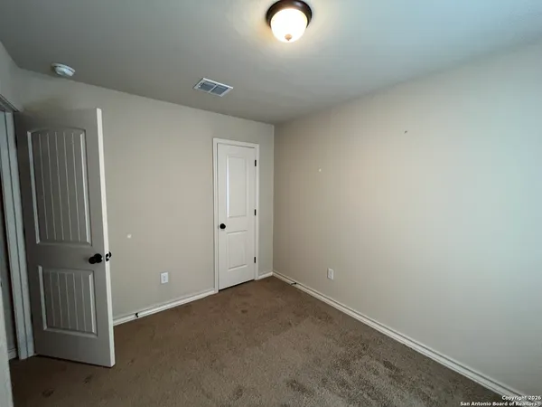 an empty room with a door