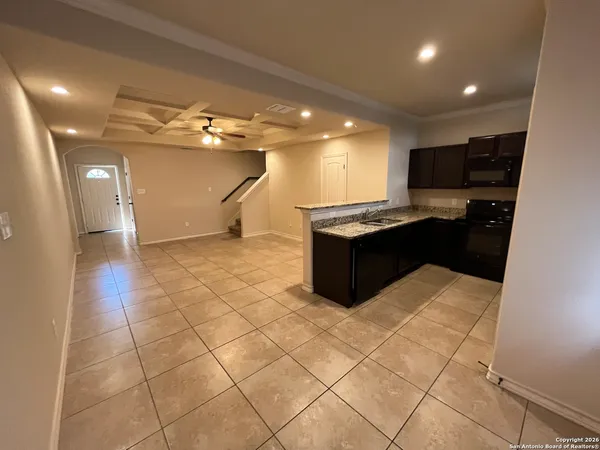 a kitchen with stainless steel appliances a sink and cabinets