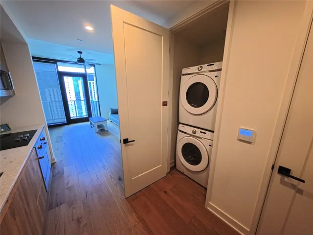 a view of a hallway with washer and dryer