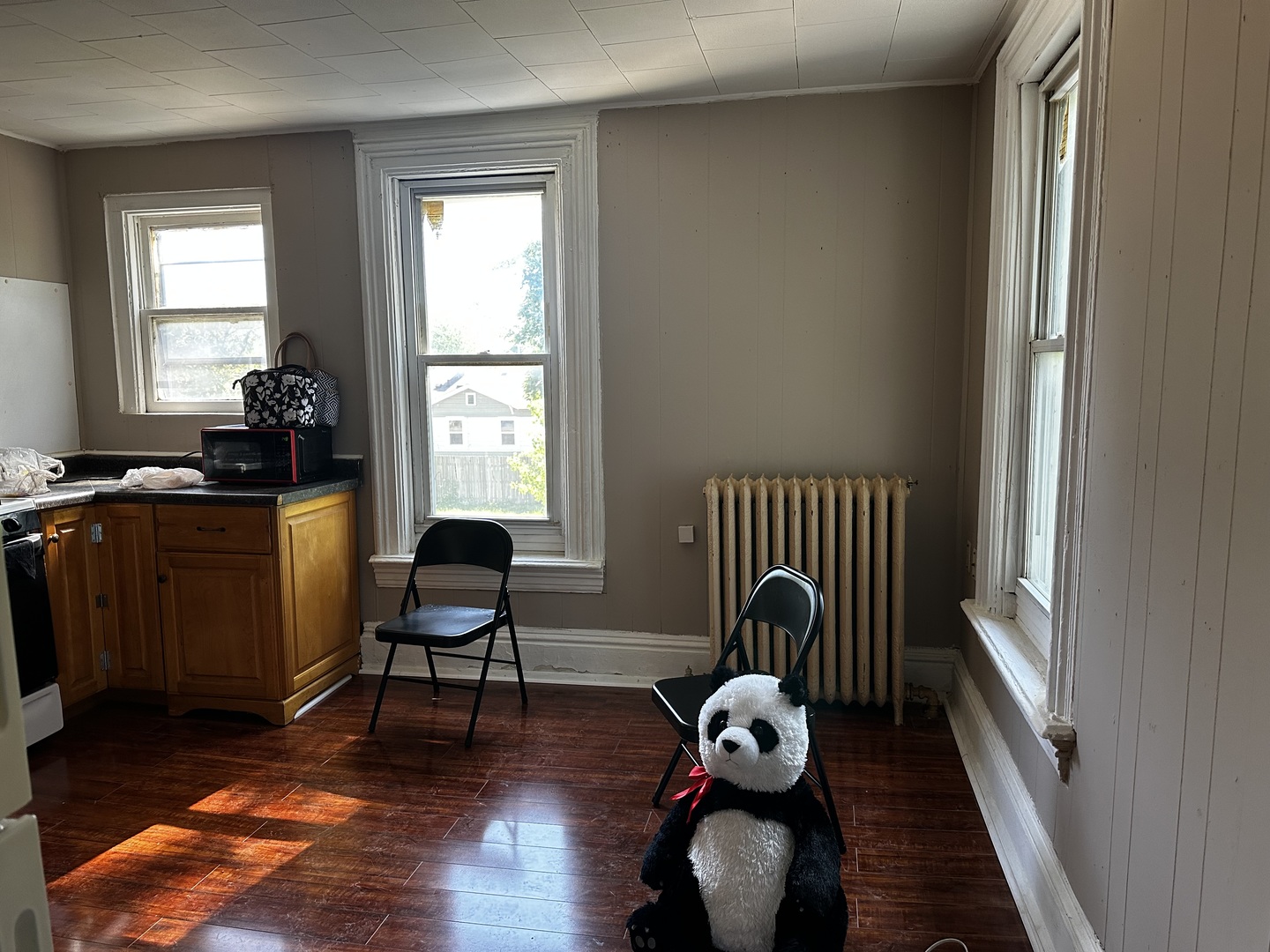 Undisclosed Address Aurora, IL 60505 - Photo 2 of 8 a view of a workspace with wooden floor and a window